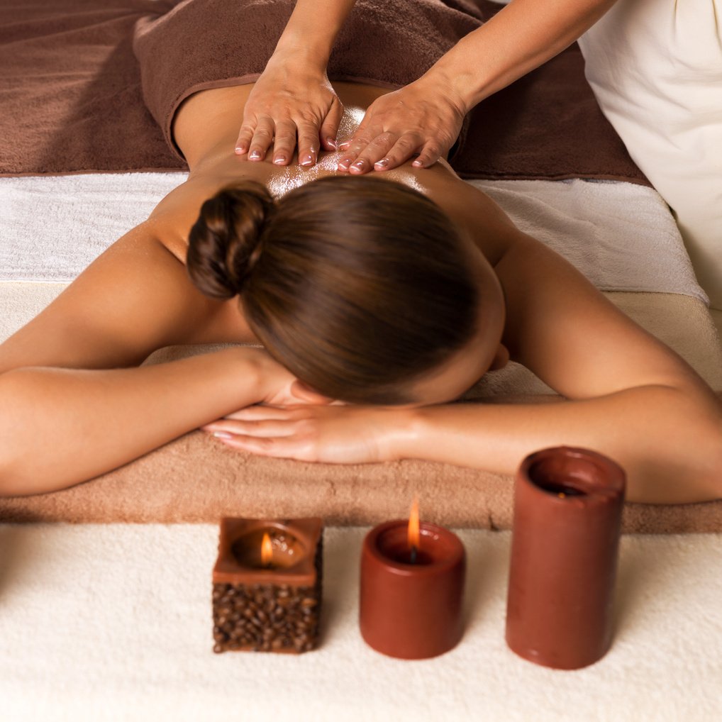 A Woman Having A Back Massage  in the Spa Salon